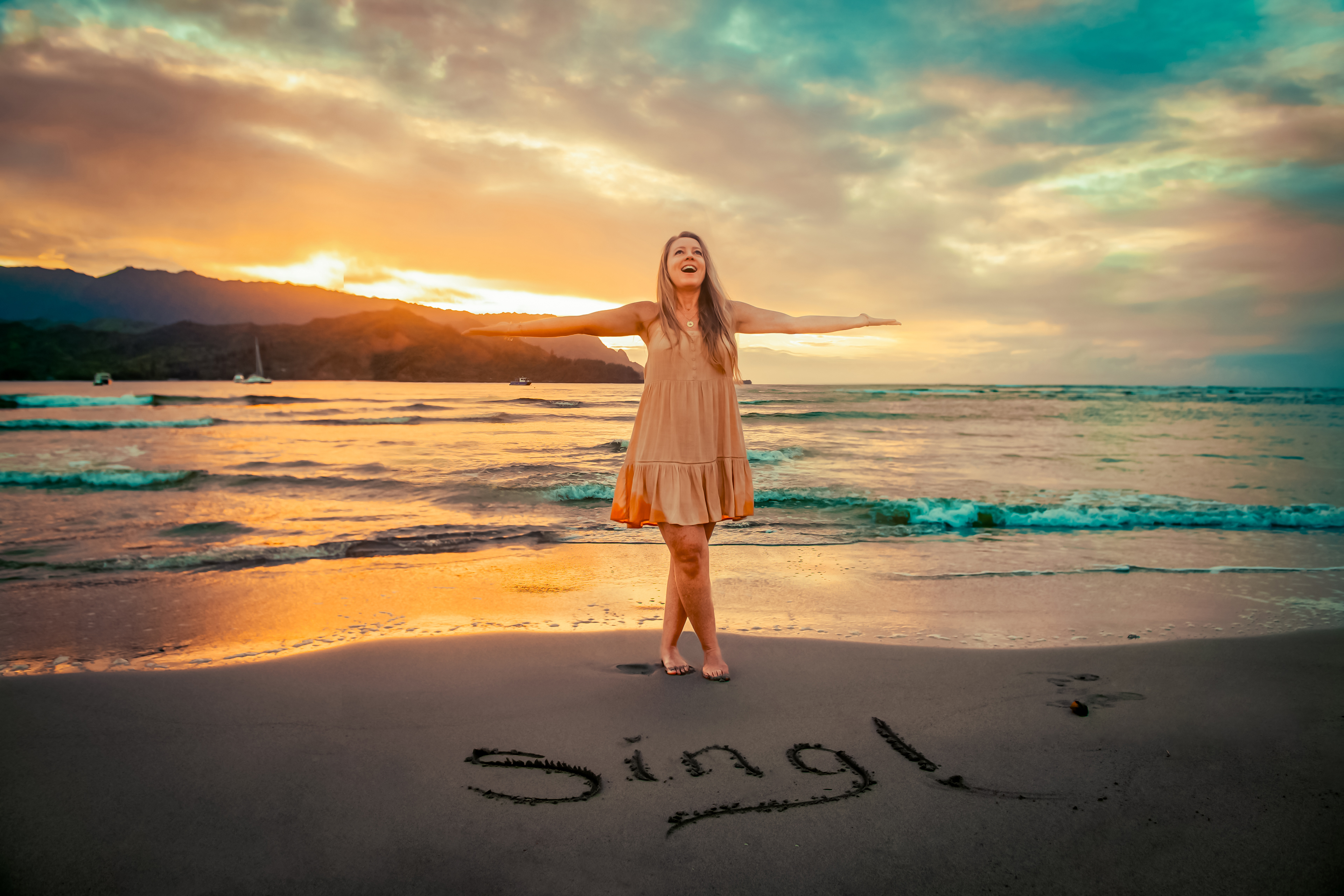 Preeta standing on the beach at sunset